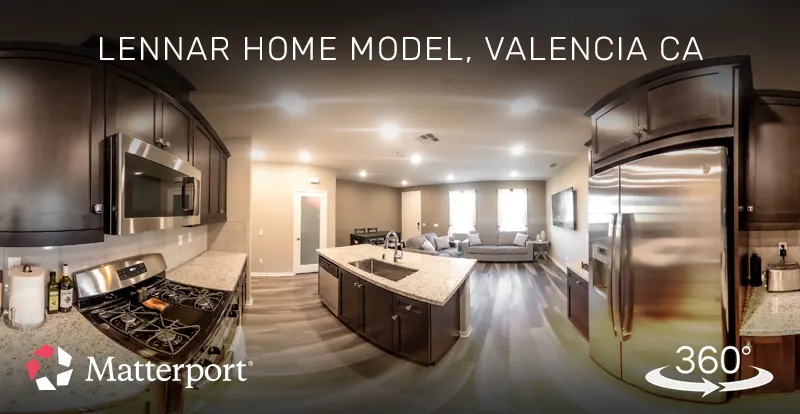 Matterport 3D virtual tour of a model home kitchen and living room in Valencia, California, created by ShutterSpin. Immersive tours highlight property features for real estate agents and home builders to market new developments.